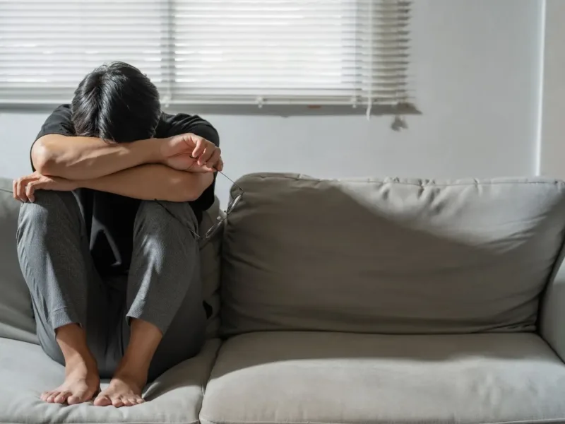 Depressed man on a sofa