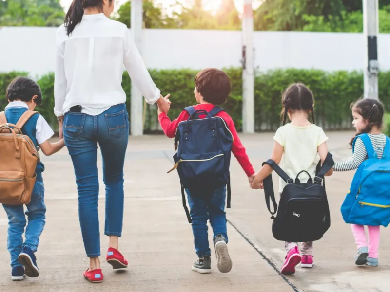 Kids walking with teacher