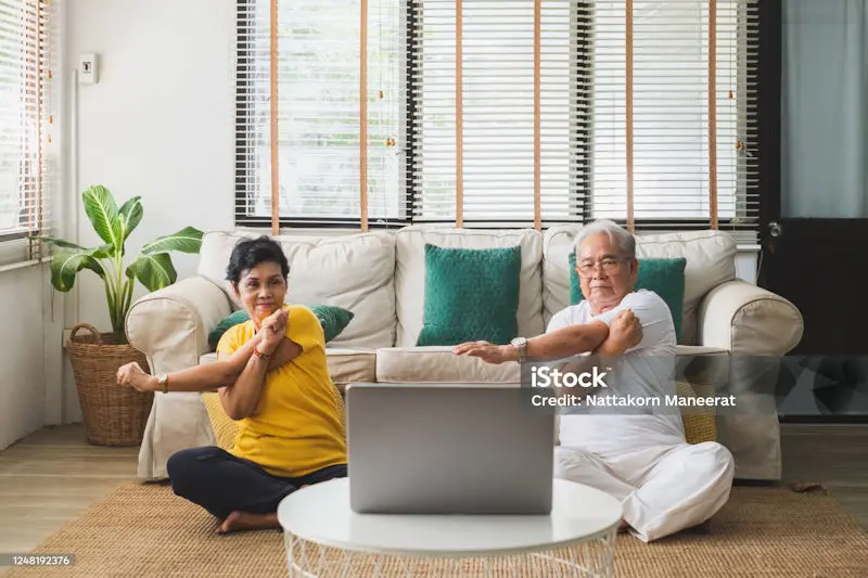Couple doing exercise at home