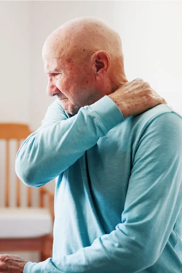 Man reaching for his back